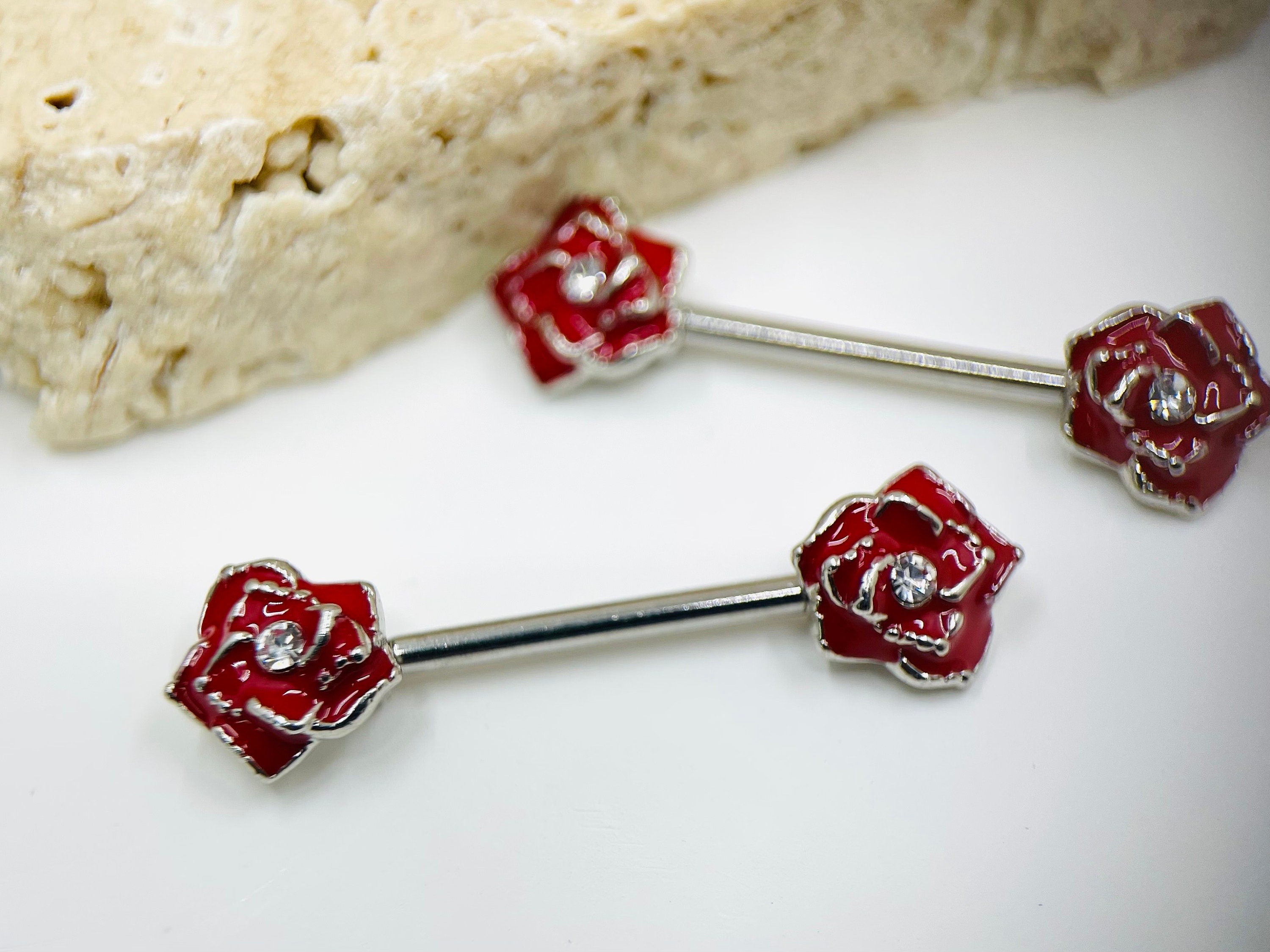 A set of Classic Red Rose Nipple Barbell