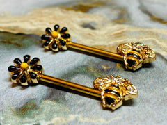 A set of Queen Bee Nipple Barbell.