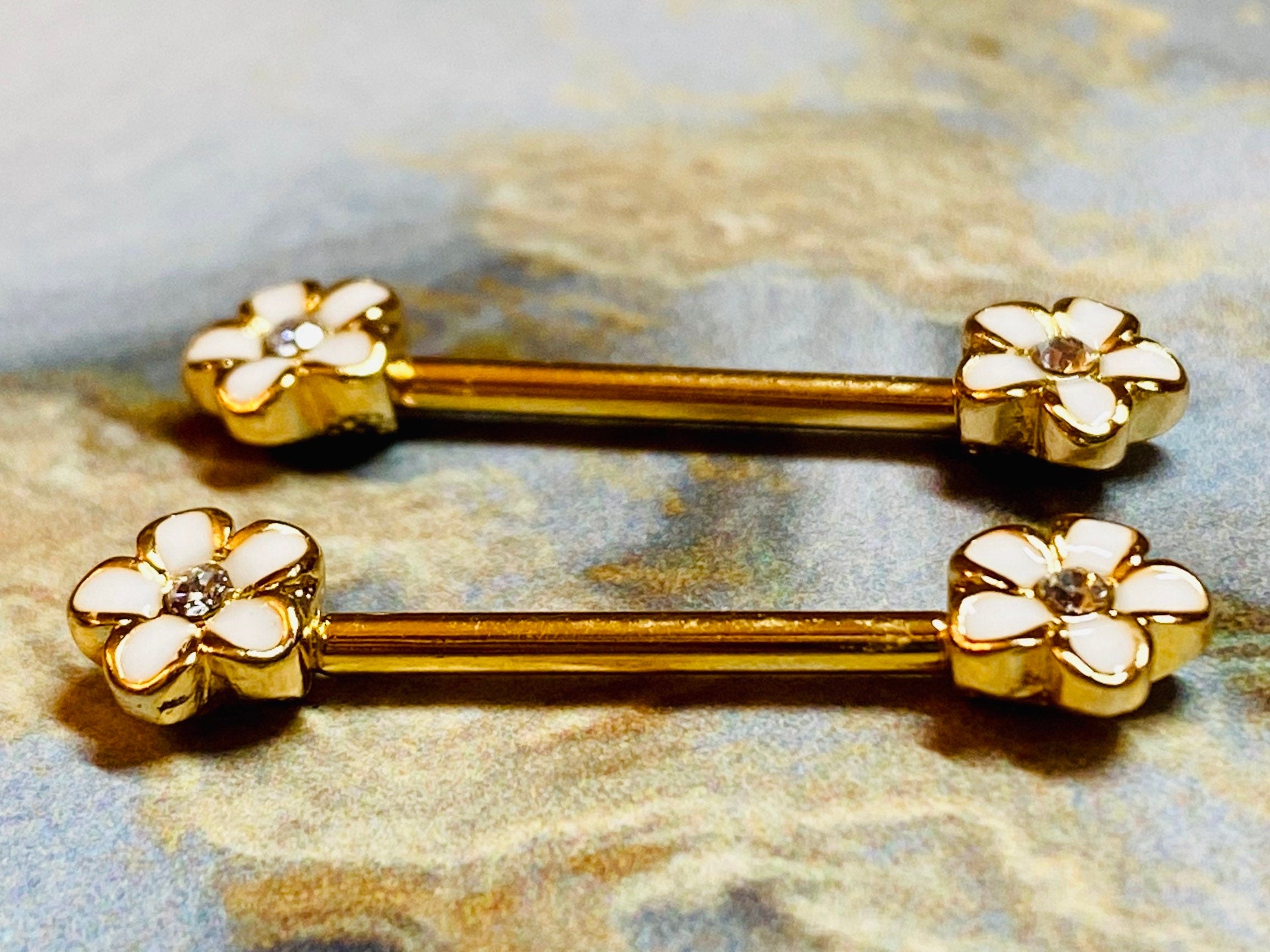 A set of Sparkling Plumeria Flowers Nipple Barbell