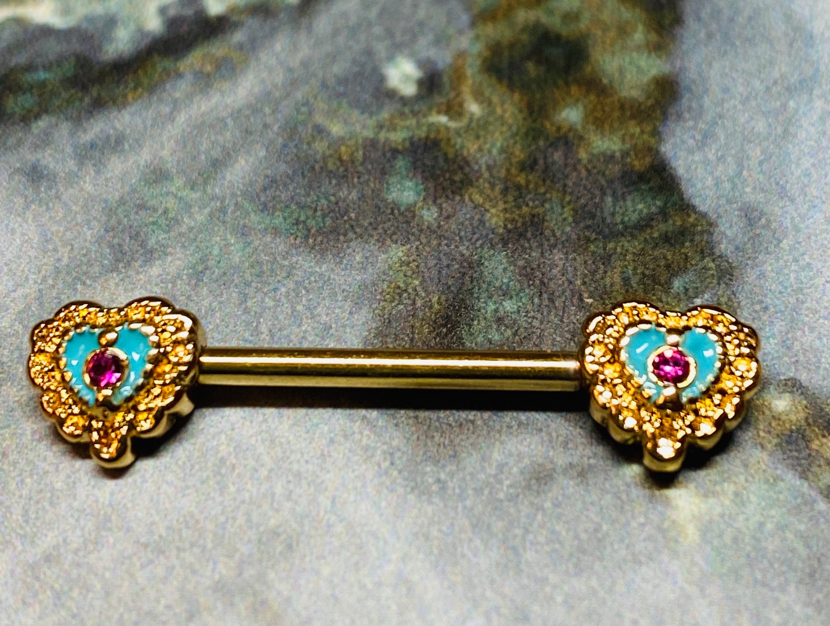 A set of Filigree Heart Nipple Barbell