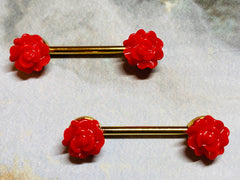 A set of Red Acrylic Rose Nipple Barbell