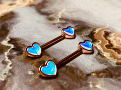 A set of Rose Gold Illuminating Heart Nipple Barbell