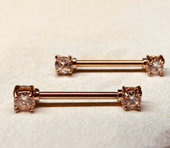 A set of Prong Set Rose Gold Clear Cubic Zirconia Nipple Barbell