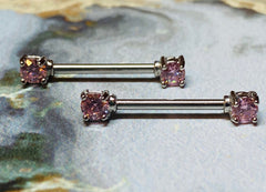 A set of Prong Set Pink 5mm Cubic Zirconia Nipple Barbell