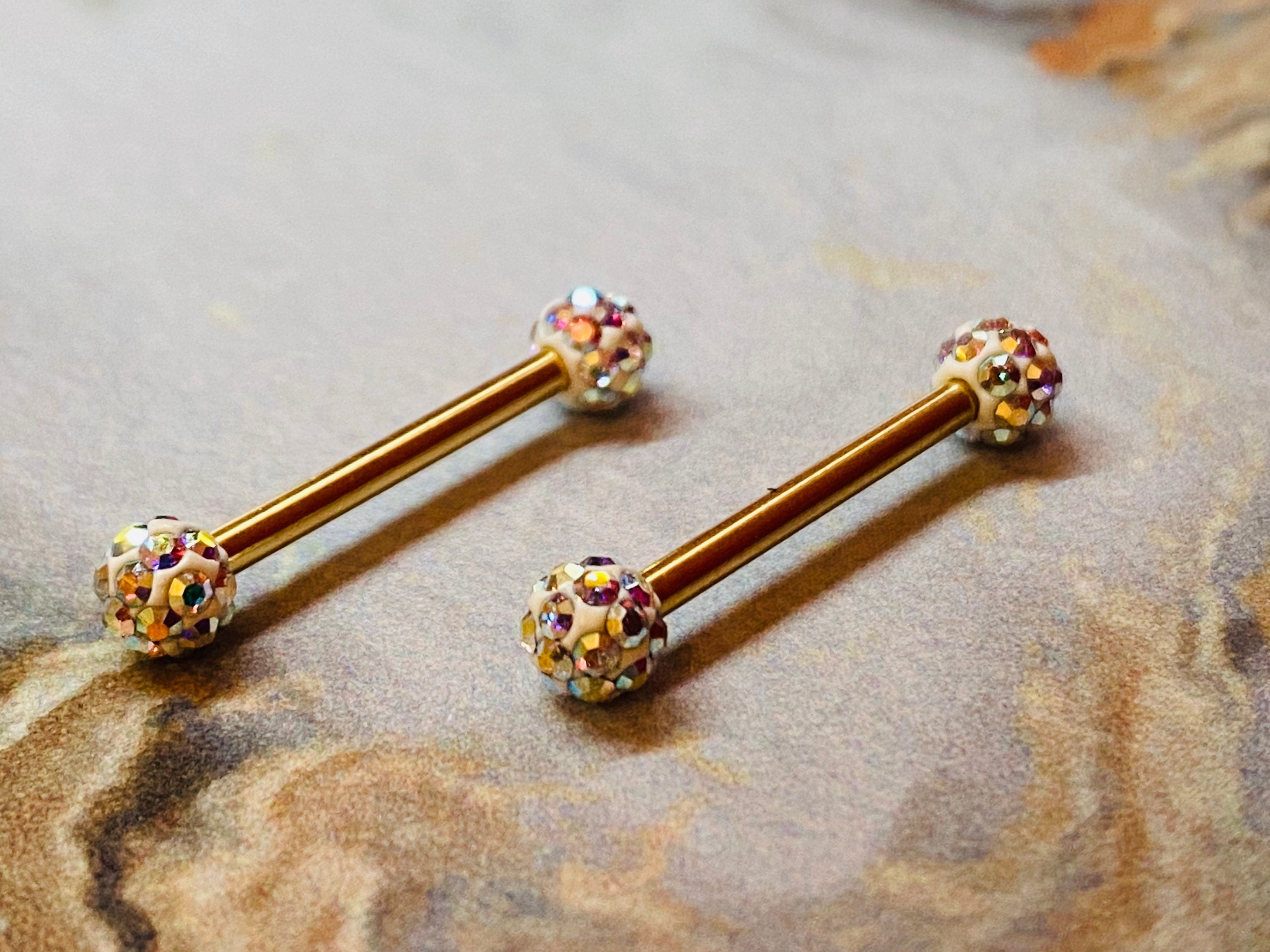 A set of Gold Multi Gem Sprinkles Nipple Barbell Ring. Nipple Piercings. Nipple Jewelry