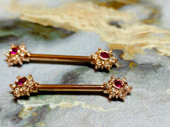 A set of Rose Gold Twinkle Stardust CZ Nipple Barbell