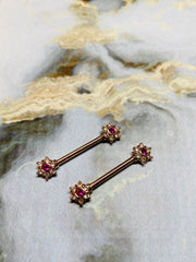 A set of Rose Gold Twinkle Stardust CZ Nipple Barbell