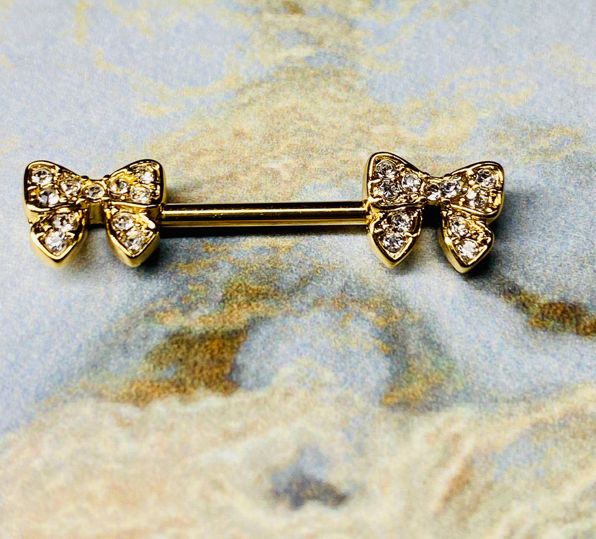 A set of Dainty Bow Tie Nipple Barbell