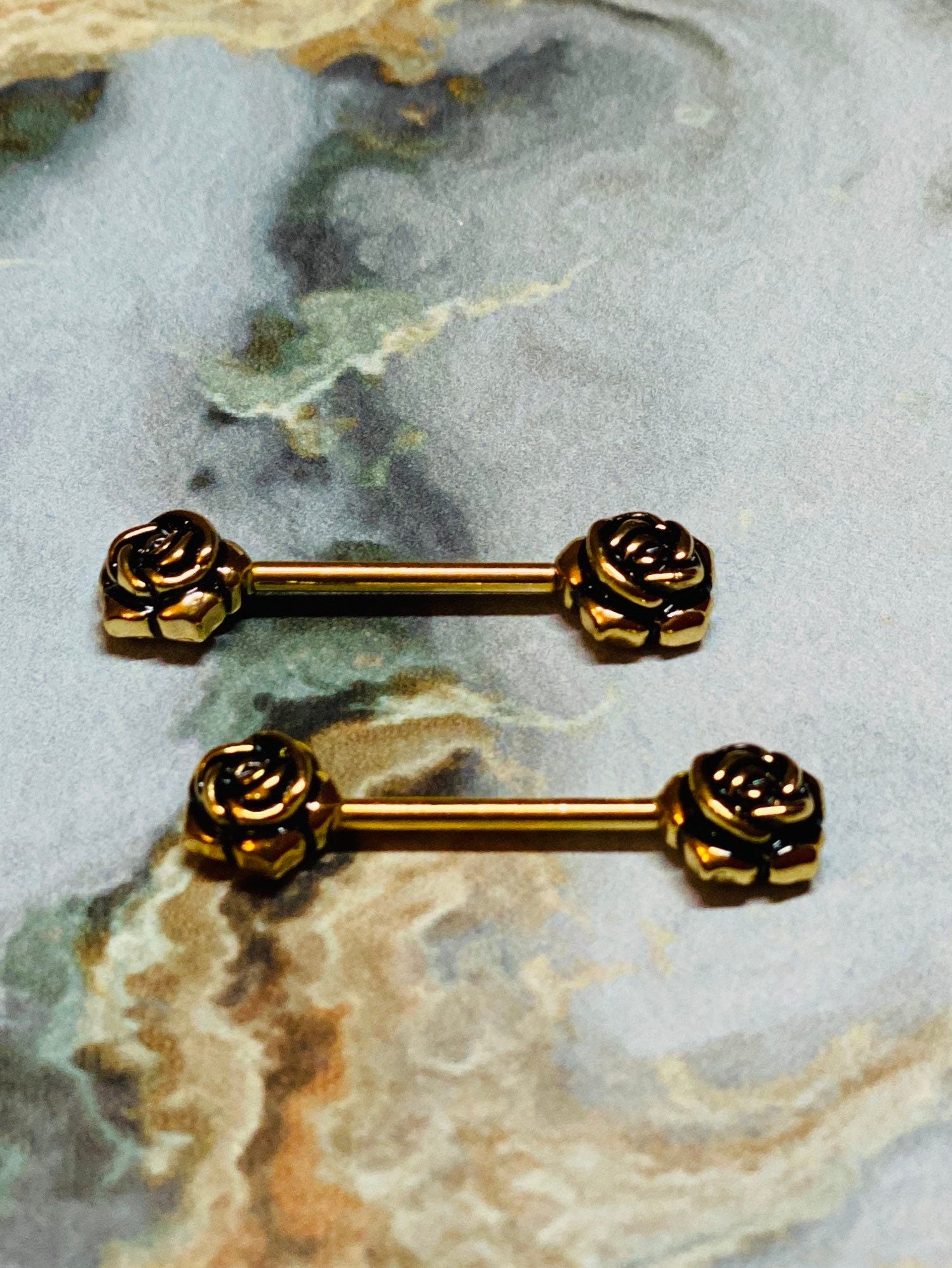 A set of Vintage Rose Nipple Barbell