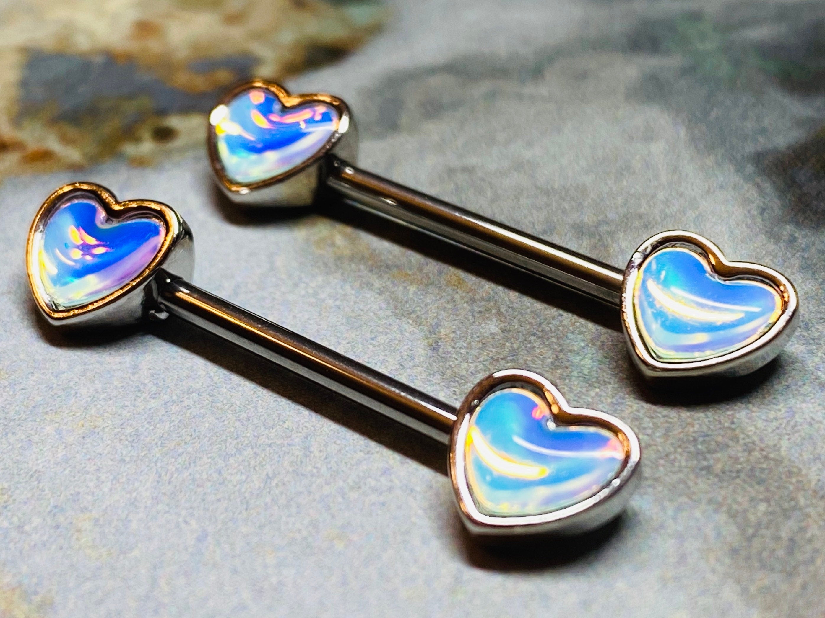 A set of illuminating Heart inlay Nipple Barbell