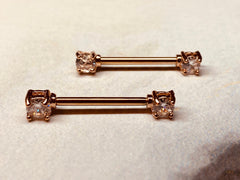 A set of Prong Set Rose Gold Clear Cubic Zirconia Nipple Barbell