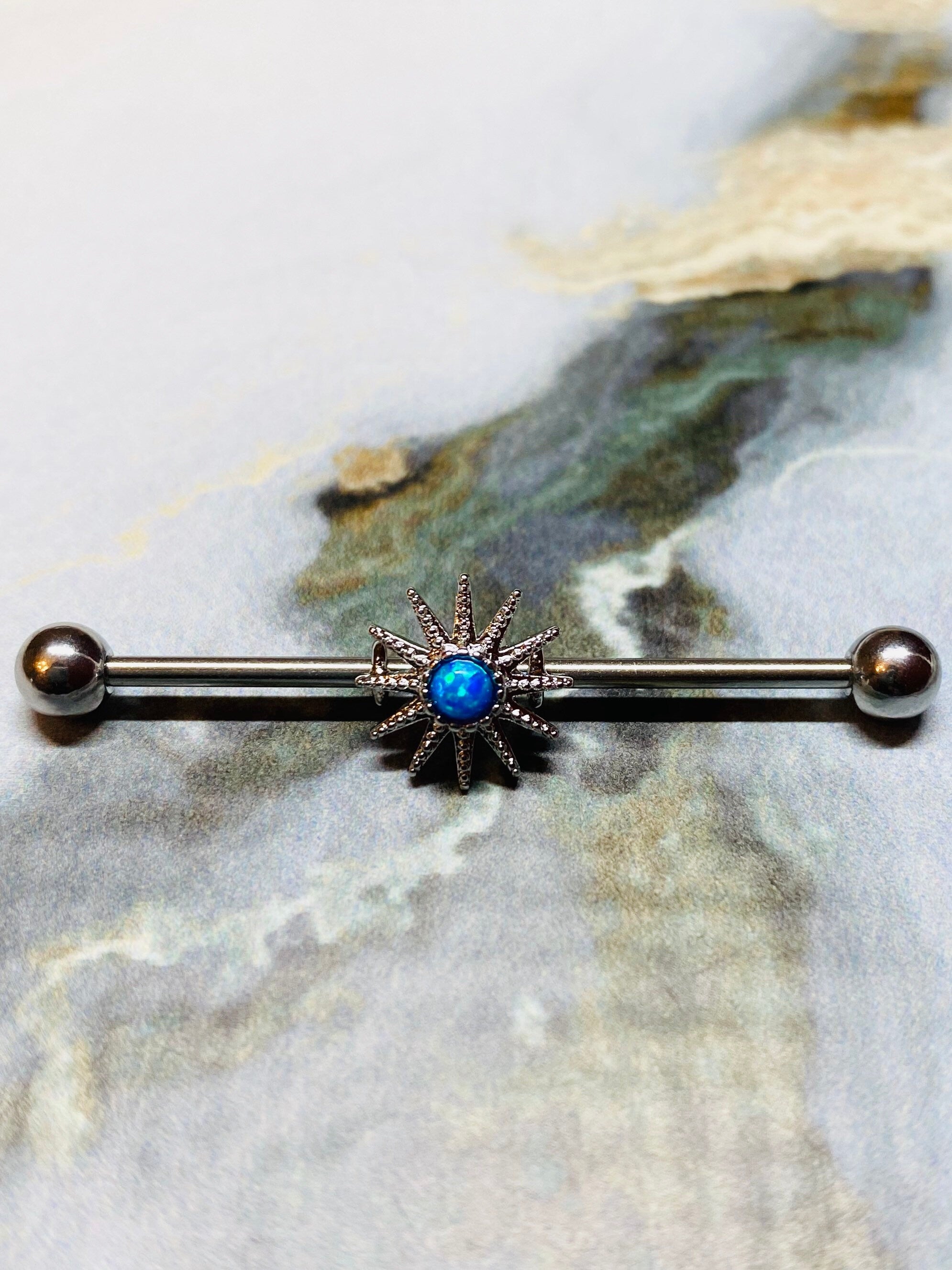 Opal centered sunburst Industrial Barbell. Industrial Piercing.