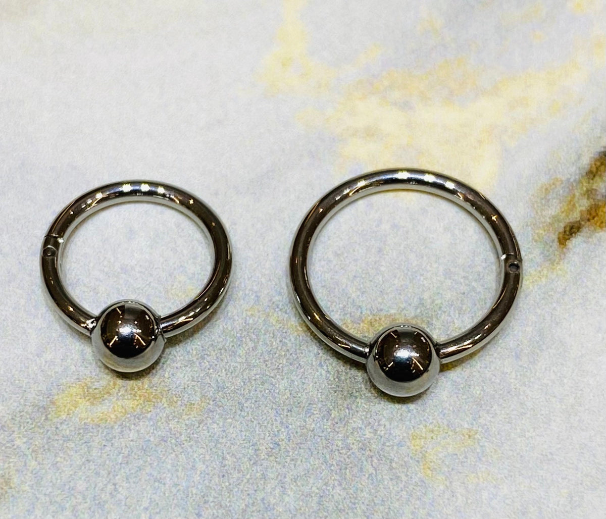 16G Silver Hinged Hoop Clicker with Undetachable Ball Center for Nose, Septum, Cartilage, Tragus Piercing and More. 8MM & 10MM.