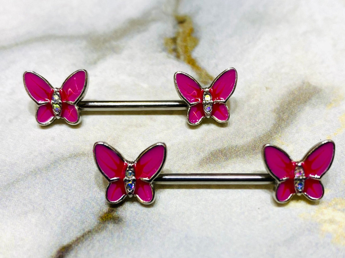 A pair of 14G Pink Butterly Ends Nipple Barbells. Nipple Jewelry. Nipple Piercing. Nipple Rings.