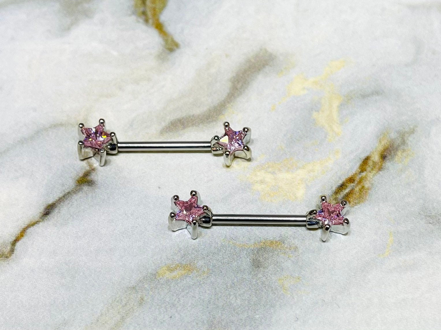 A set of Classic Star Pink Stone Nipple Barbell Ring. Nipple Jewelry. Nipple Piercings.