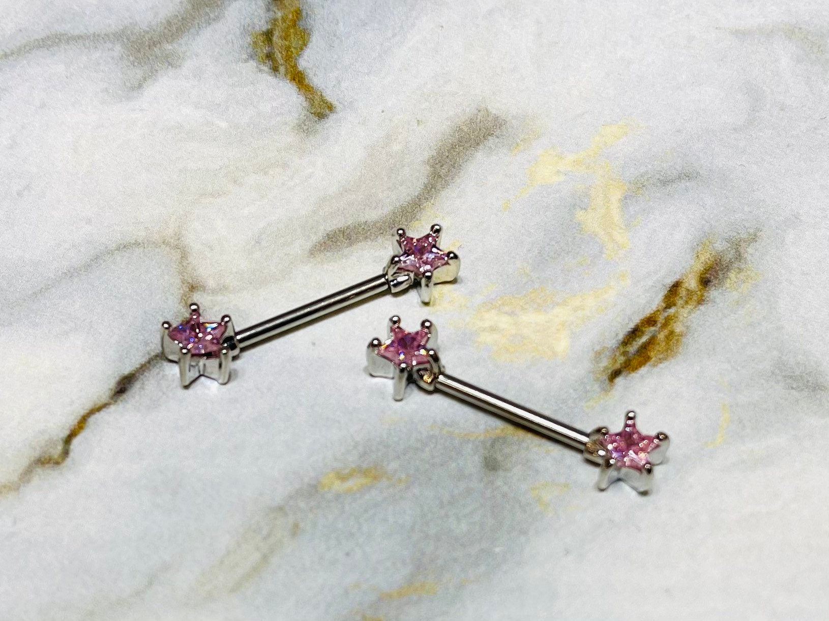 A set of Classic Star Pink Stone Nipple Barbell Ring. Nipple Jewelry. Nipple Piercings.