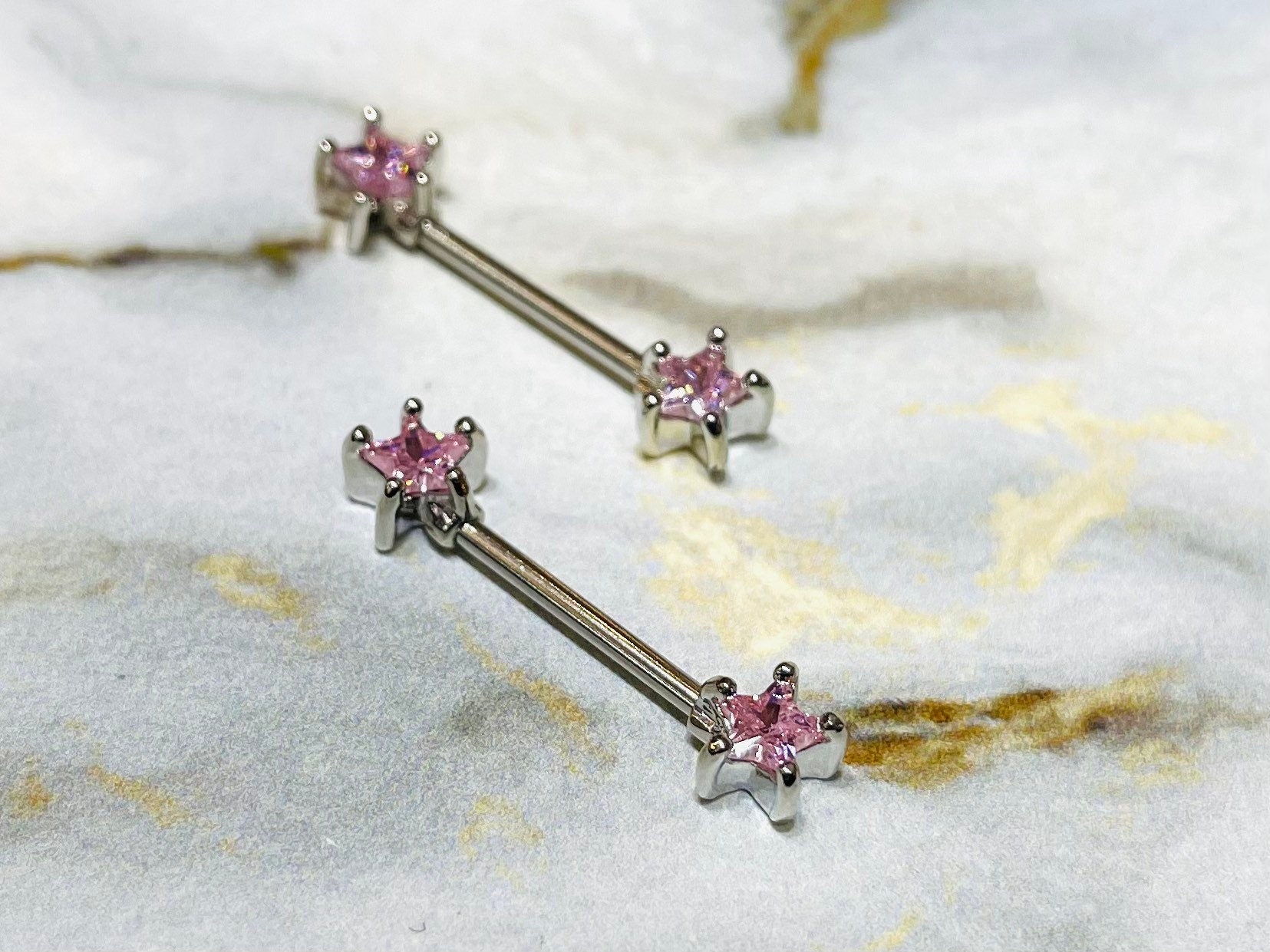 A set of Classic Star Pink Stone Nipple Barbell Ring. Nipple Jewelry. Nipple Piercings.