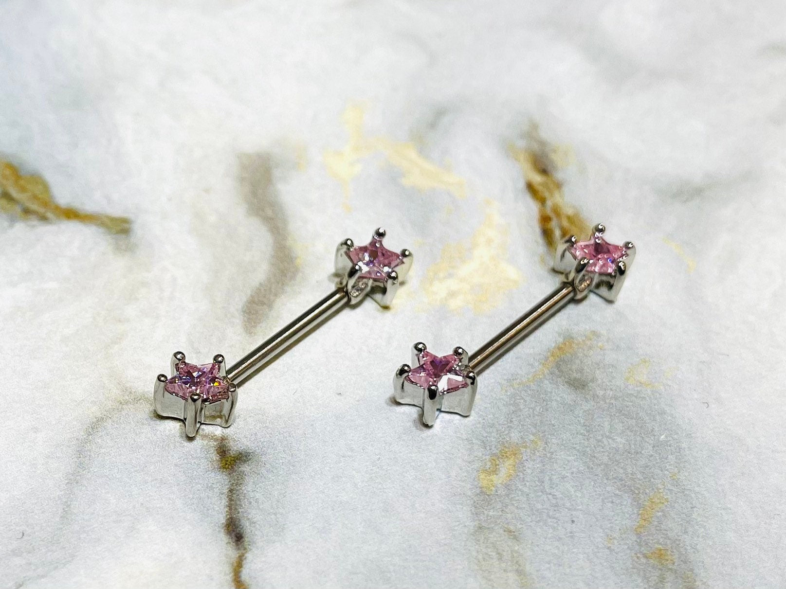 A set of Classic Star Pink Stone Nipple Barbell Ring. Nipple Jewelry. Nipple Piercings.