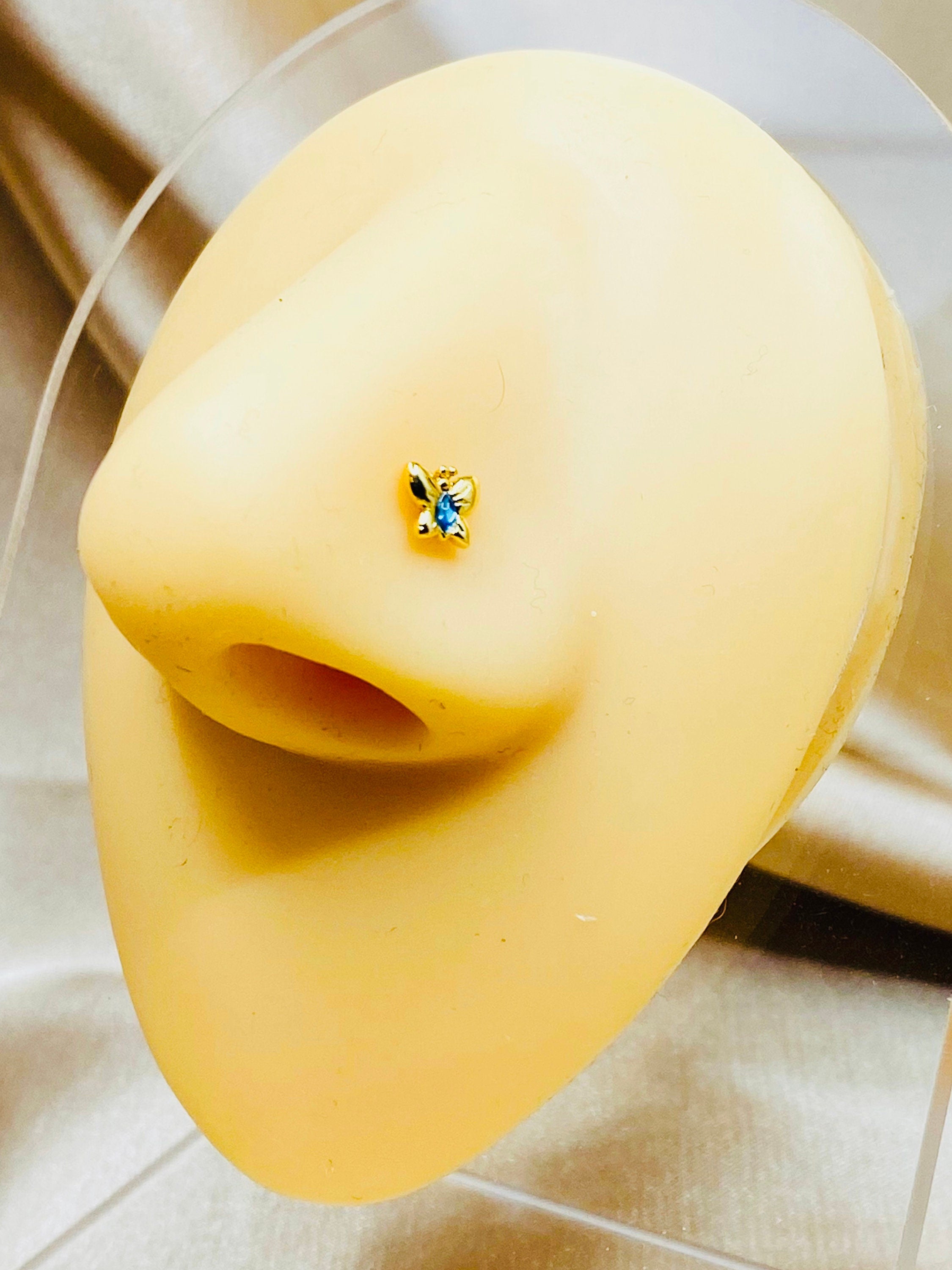 20G Gold Butterfly with Blue Stone Nose Stud.