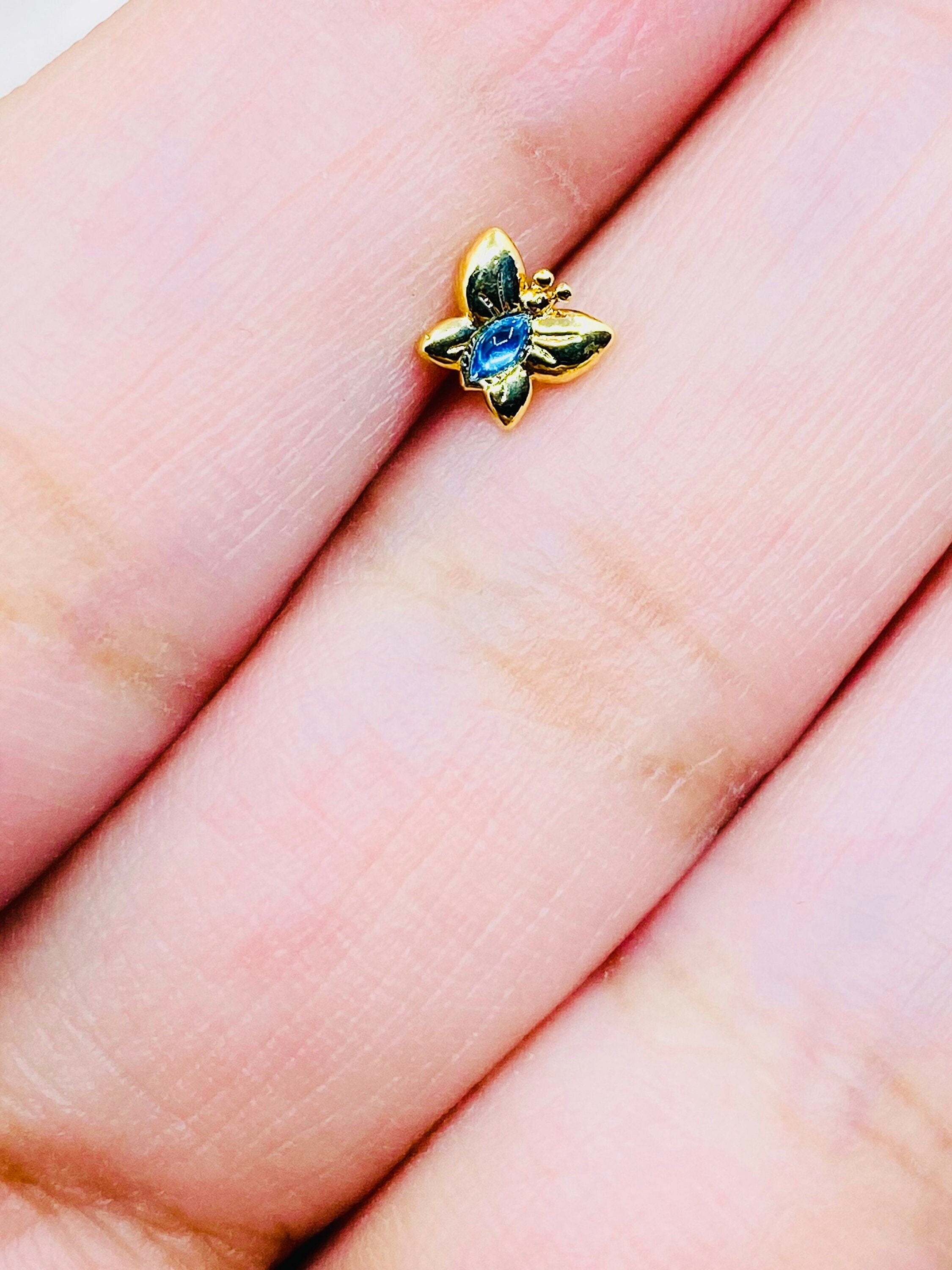 20G Gold Butterfly with Blue Stone Nose Stud.