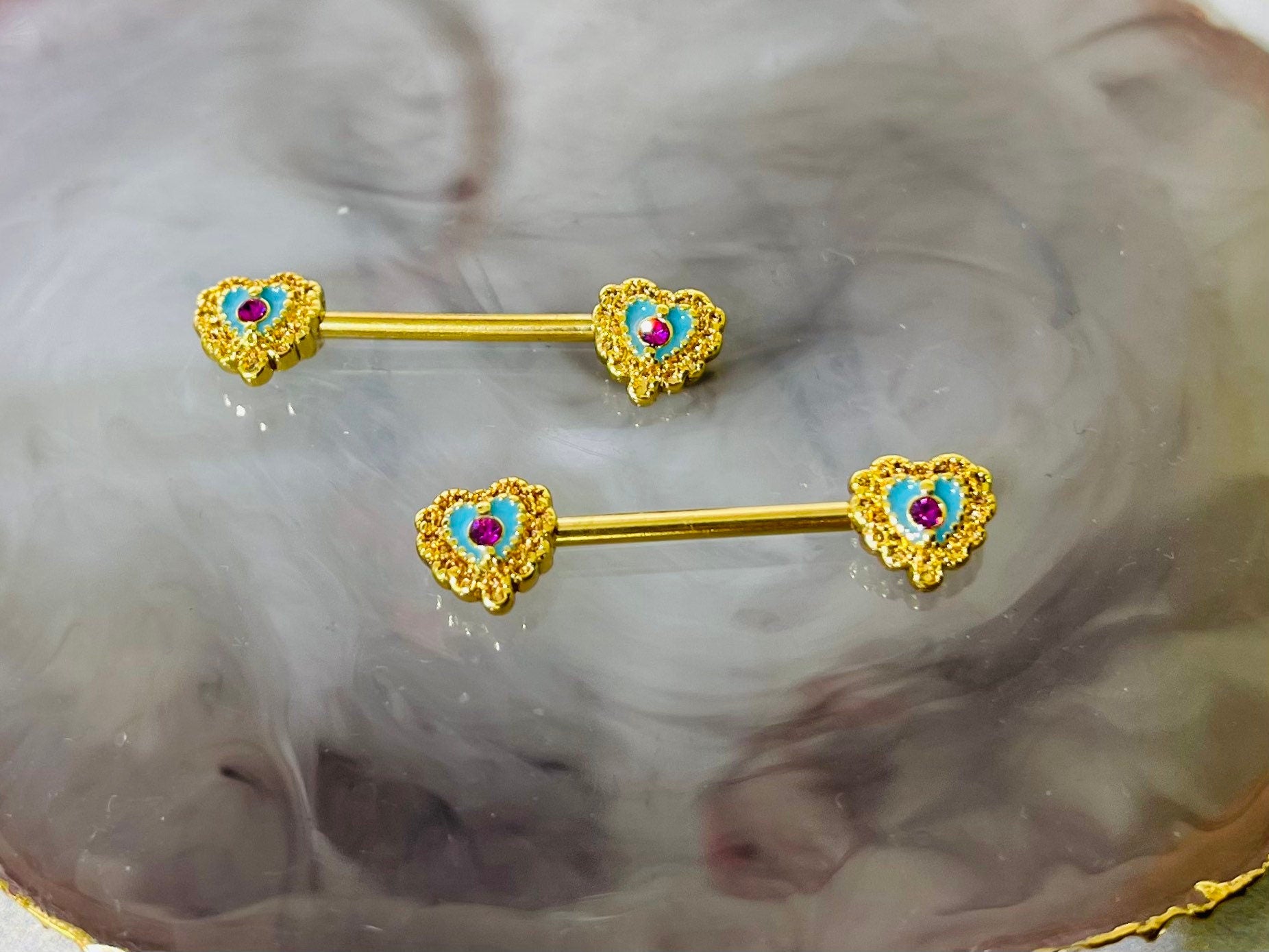 A set of Filigree Heart Nipple Barbell