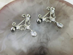 Pair of 14G Silver Heart Filigree with Dangling Teardrop Nipple Barbell.