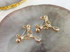 Pair of 14G Rose Gold Heart Filigree with Dangling Teardrop Nipple Barbell.