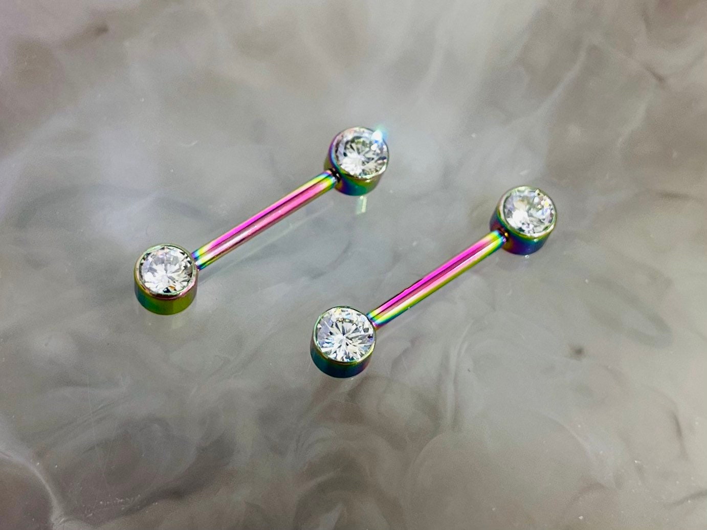 Pair of 14G Implant Grade Titanium Internally Threaded Rainbow Bezel Set Clear Stone Nipple Barbell.