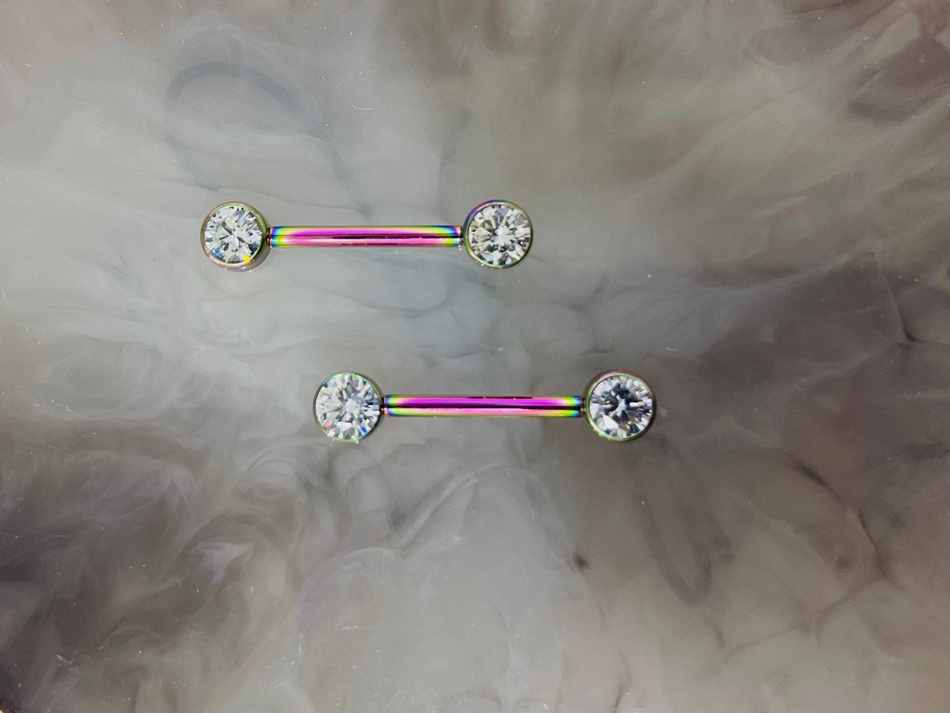 Pair of 14G Implant Grade Titanium Internally Threaded Rainbow Bezel Set Clear Stone Nipple Barbell.