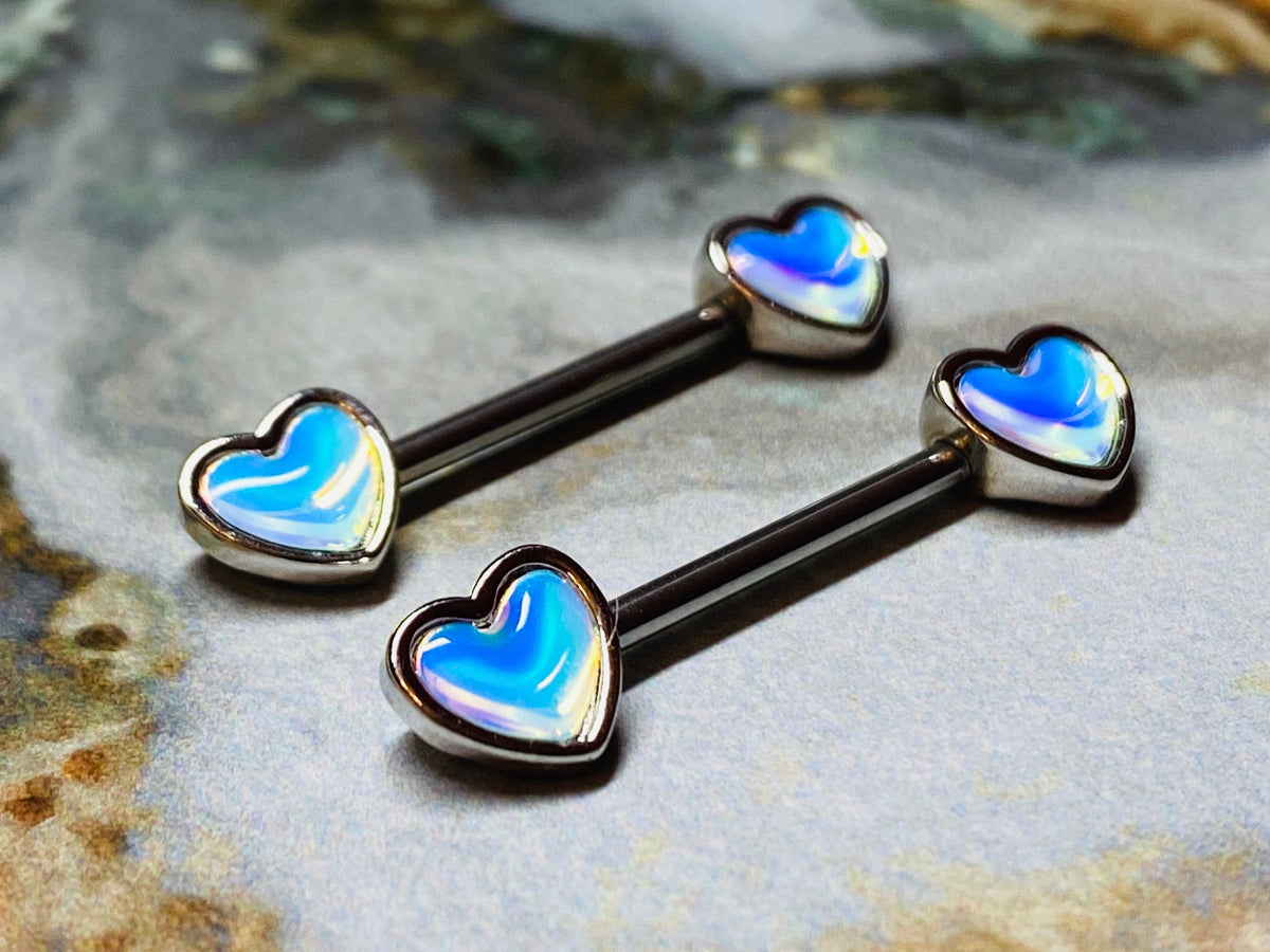 A set of illuminating Heart inlay Nipple Barbell