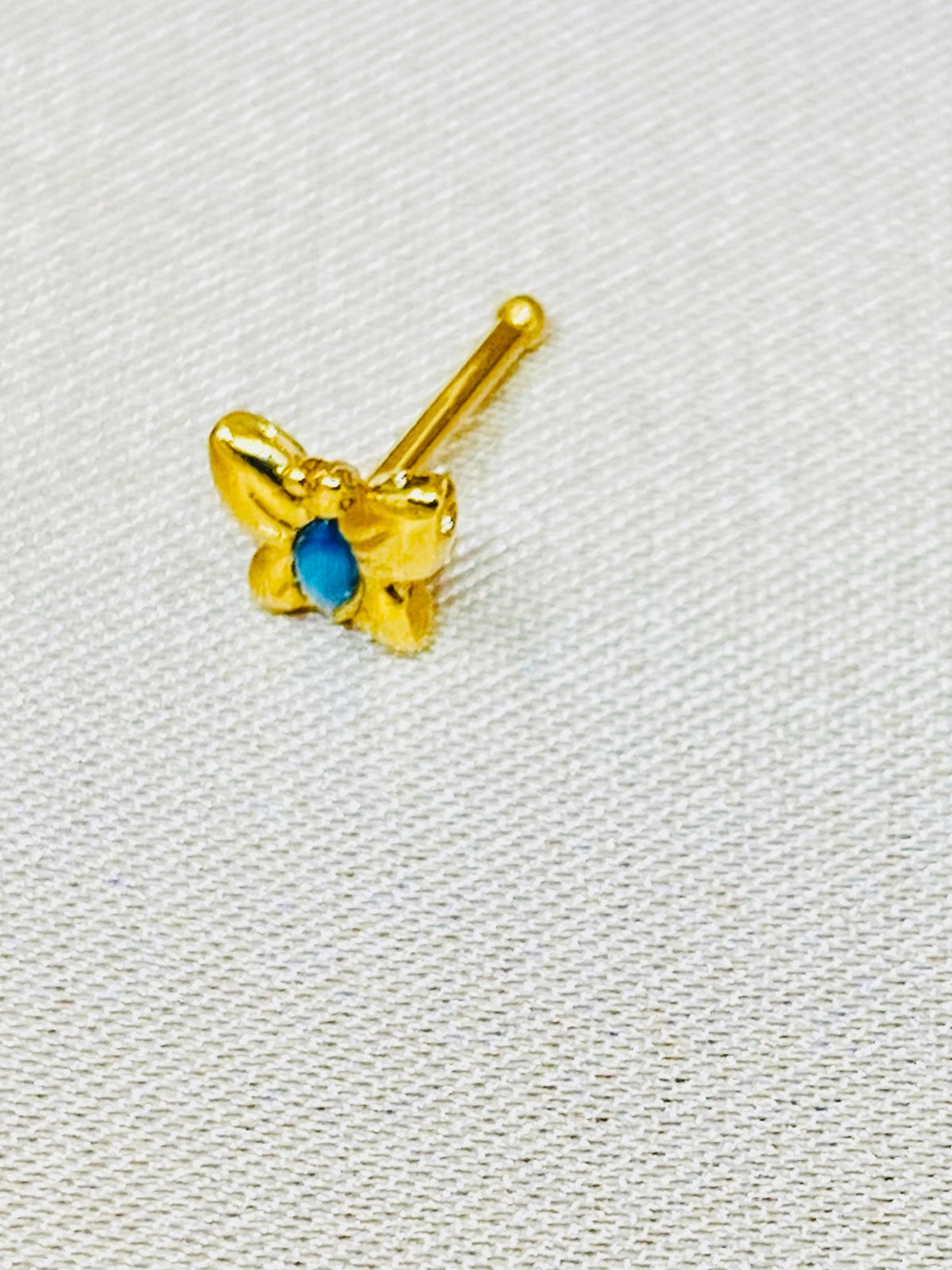 20G Gold Butterfly with Blue Stone Nose Stud.