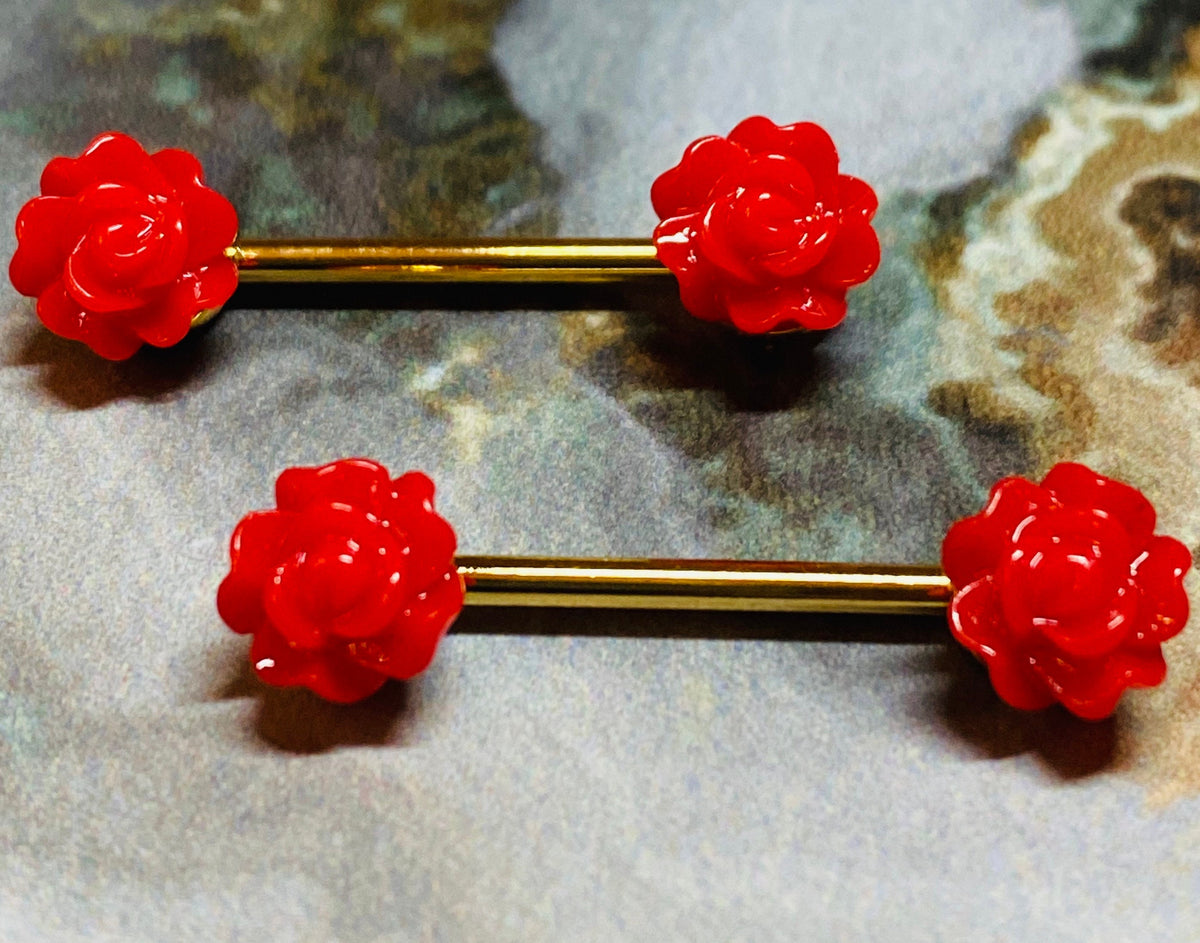 A set of Red Acrylic Rose Nipple Barbell