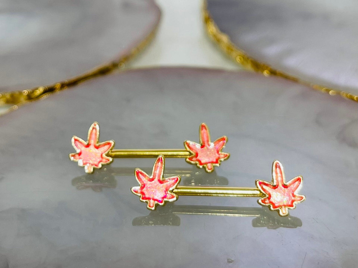 Pair of 14G Gold Pink Glitter Marijuana Leaf Nipple Barbell.