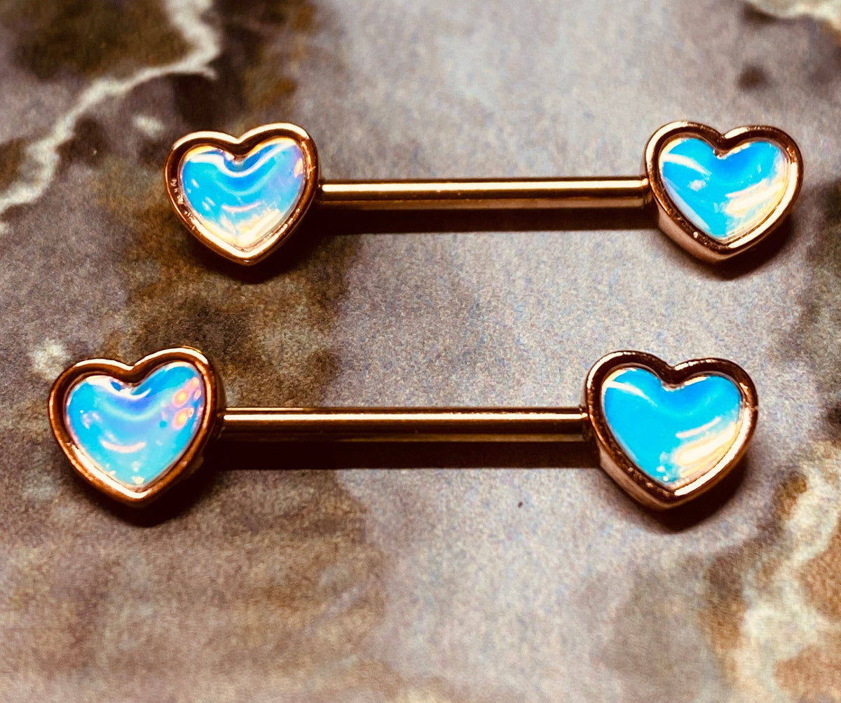 A set of Rose Gold Illuminating Heart Nipple Barbell