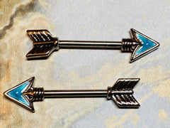 A set of Follow Your Own Arrow Nipple Barbell