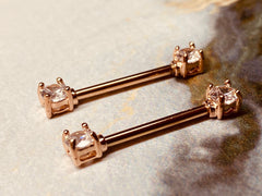 A set of Prong Set Rose Gold Clear Cubic Zirconia Nipple Barbell