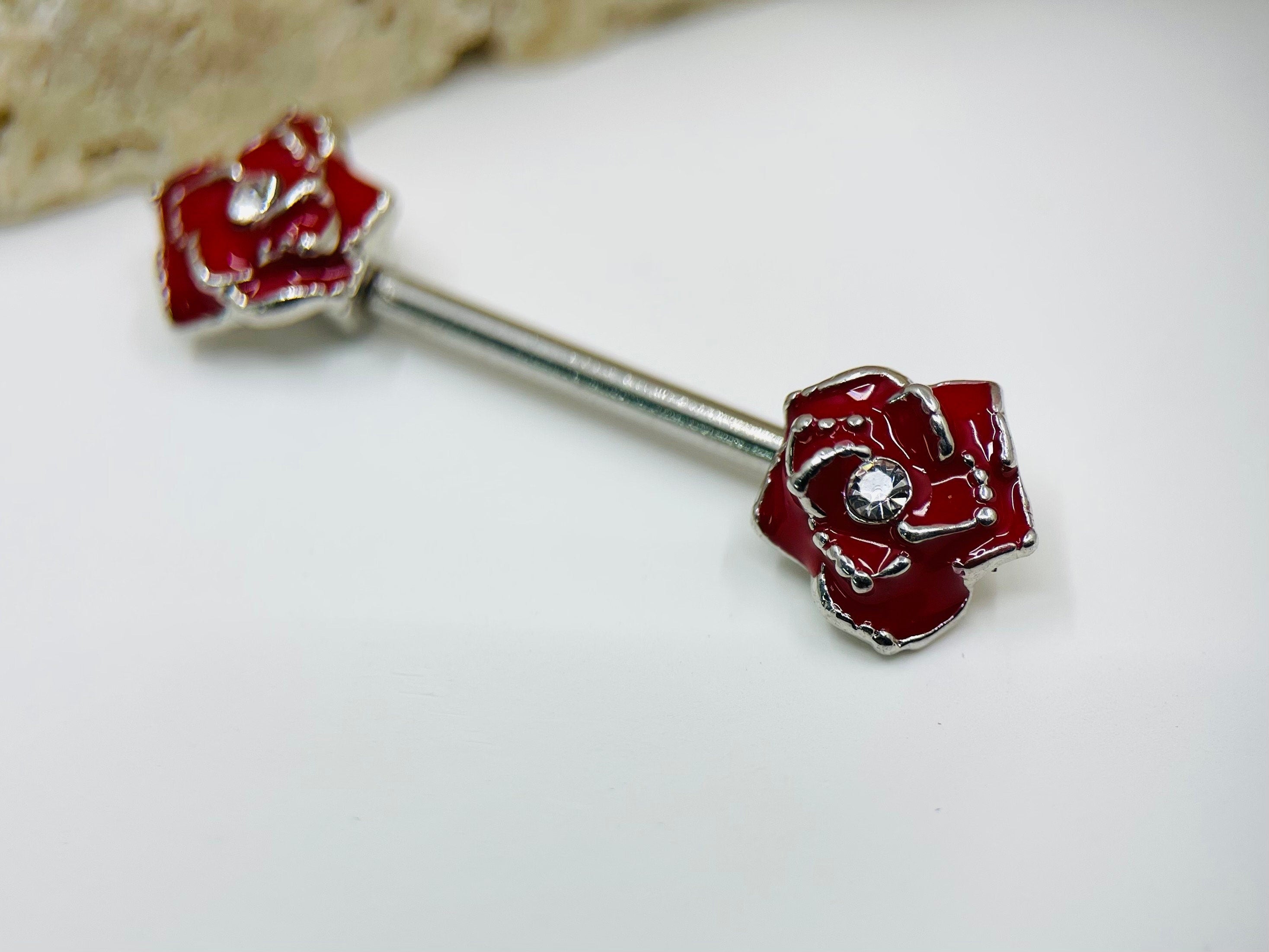 A set of Classic Red Rose Nipple Barbell